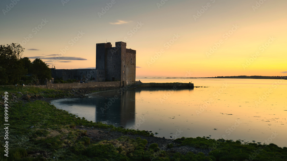 Beautiful coastal sunset scenery with historical landmark Oranmore castle at Galway bay, Ireland, Wild Atlantic way, buildings and architecture background, wallpaper