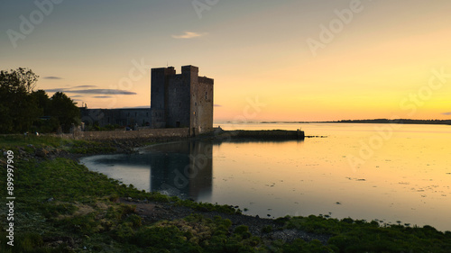 Obraz na płótnie Beautiful coastal sunset scenery with historical landmark Oranmore castle at Galway bay, Ireland, Wild Atlantic way, buildings and architecture background, wallpaper w salonie