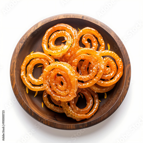 Plate of tasty Jalebi with on white background. photo