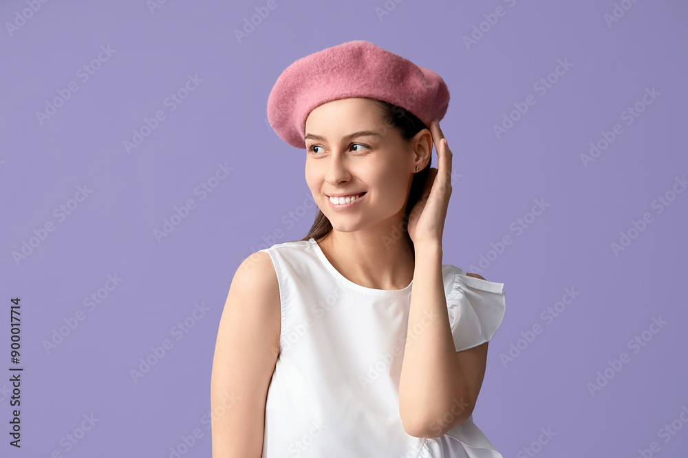 Beautiful young woman in stylish pink beret hat on lilac background Beautiful young woman in stylish pink beret hat on lilac background