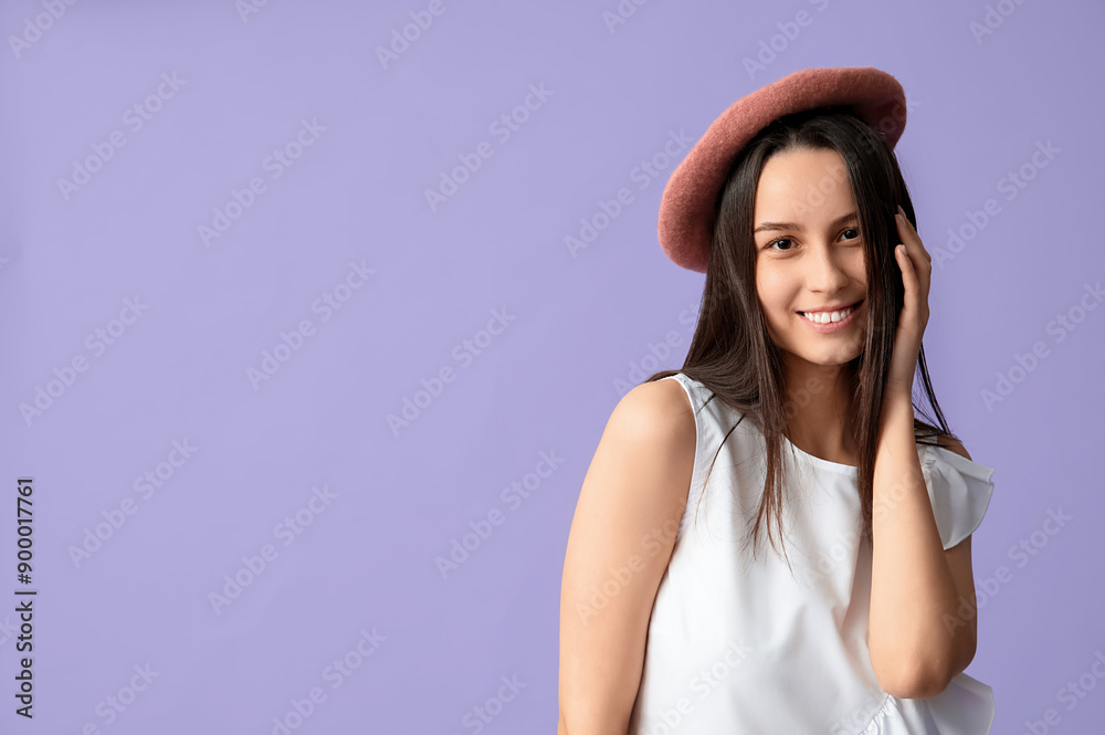Beautiful young woman in stylish pink beret hat on lilac background Beautiful young woman in stylish pink beret hat on lilac background