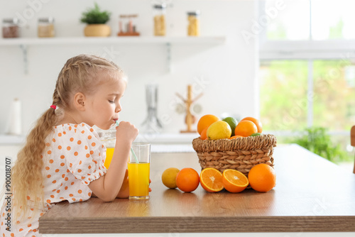 Cute little girl drinking o...