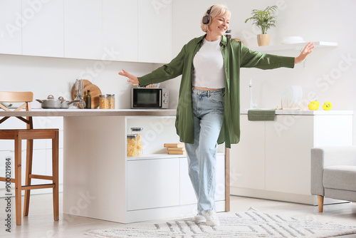 Happy senior woman dancing ...