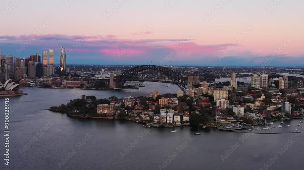 Scenic urban sunrise over Sydney Harbour in aerial panorama of city waterfront 4k.
Scenic urban sunrise over Sydney Harbour in aerial panorama of city waterfront 4k.