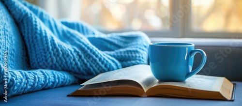 A blue coffee cup on the so...