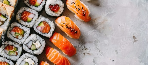 A variety of sushi rolls fe...