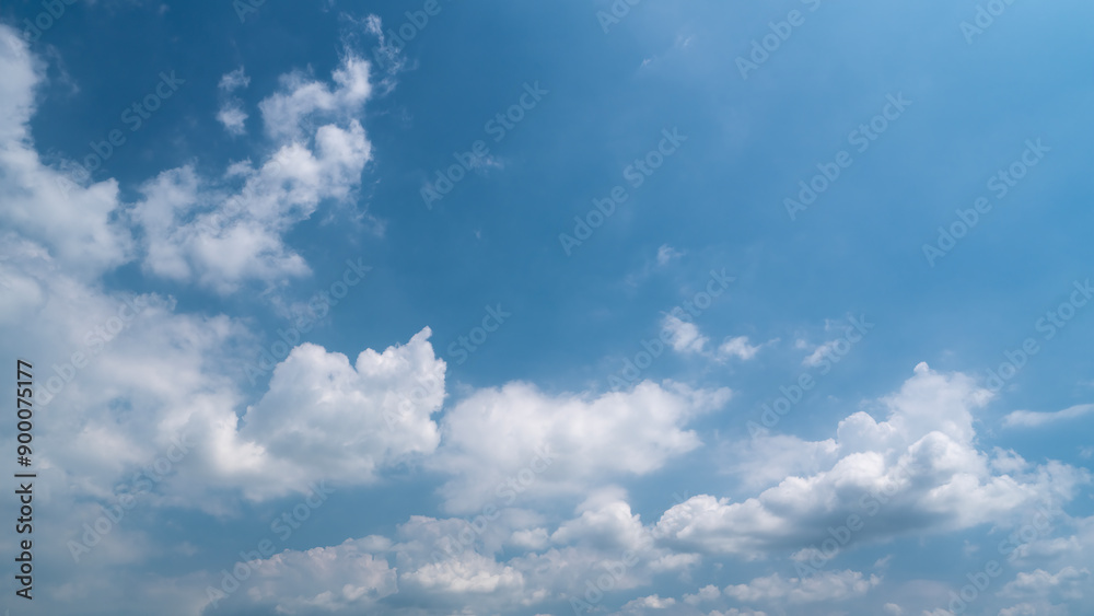 Obraz premium Serene Blue Sky with Fluffy White Clouds in Bright Daylight