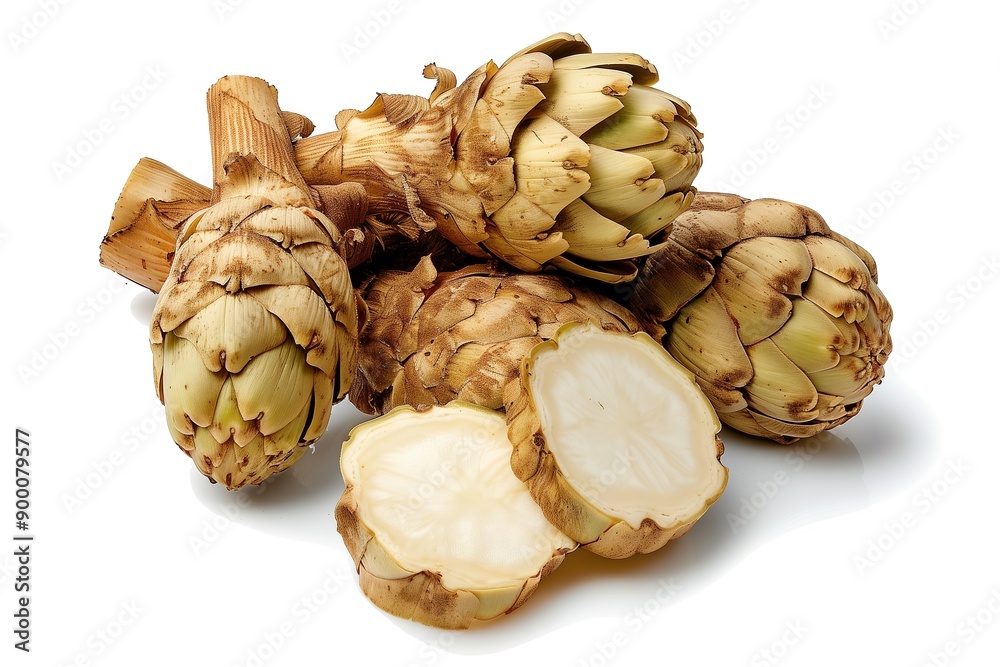 Fototapeta premium Close-up of fresh artichokes, some cut in half, showcasing texture and details, against white background