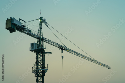 Crane and building construction site with the blue sky