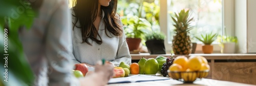 Young woman in a kitchen with fresh fruits and a diet plan. Modern nutrition and wellness. photo