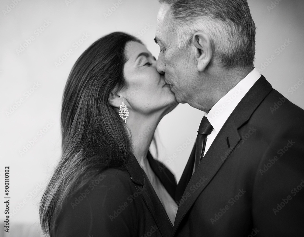 Romantic Couple Kissing in Black and White Film Noir Style Monochromatic Portrait Romantic Couple Kissing in Black and White Film Noir Style Monochromatic Portrait