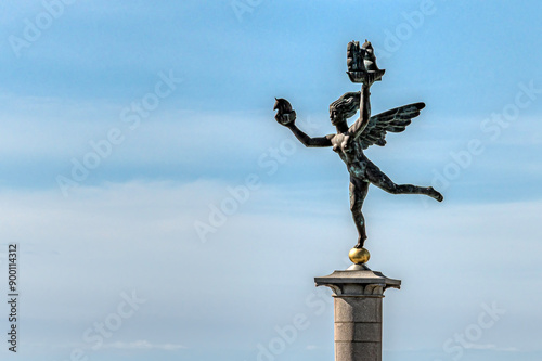 Obraz na płótnie Bronze statue of a goddess on a column in the harbour of Helsingborg, Sweden w salonie