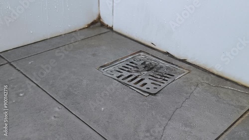  shower and the water starts to accumulate and drains into clogged grey drain in shower cabin.