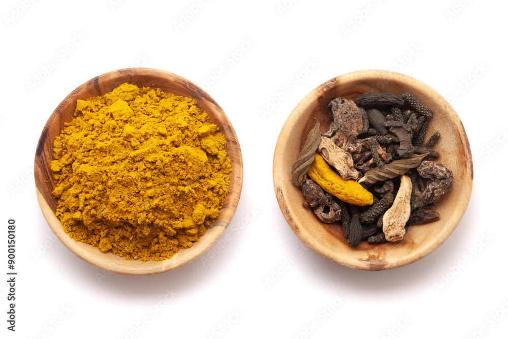 Top view of two wooden bowls, one filled with organic digestive powder known as 'buknu' and the second one filled with its whole spices. Top view of two wooden bowls, one filled with organic digestive powder known as 'buknu' and the second one filled with its whole spices.