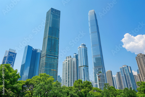 Skyscrapers Reaching into a Bright Blue Sky with White Clouds on a Sunny Day