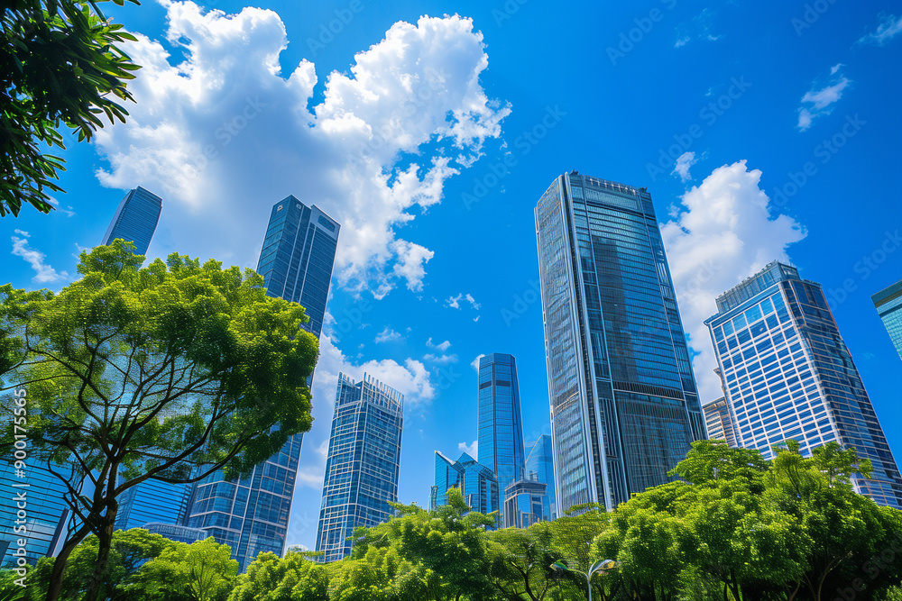 Skyscrapers Reaching into a Bright Blue Sky with White Clouds on a Sunny Day Skyscrapers Reaching into a Bright Blue Sky with White Clouds on a Sunny Day