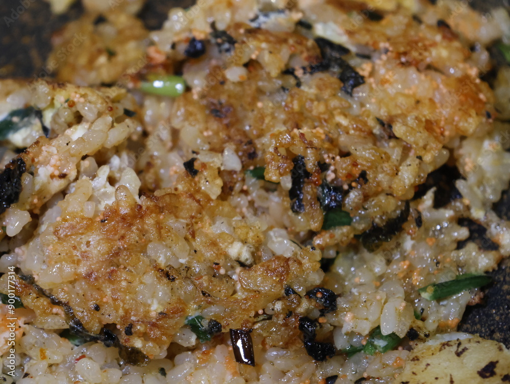Korean fried rice after barbeque on the grill. Crispy bokkeumbob, crunchy rice with vegetables. Korean fried rice after barbeque on the grill. Crispy bokkeumbob, crunchy rice with vegetables.