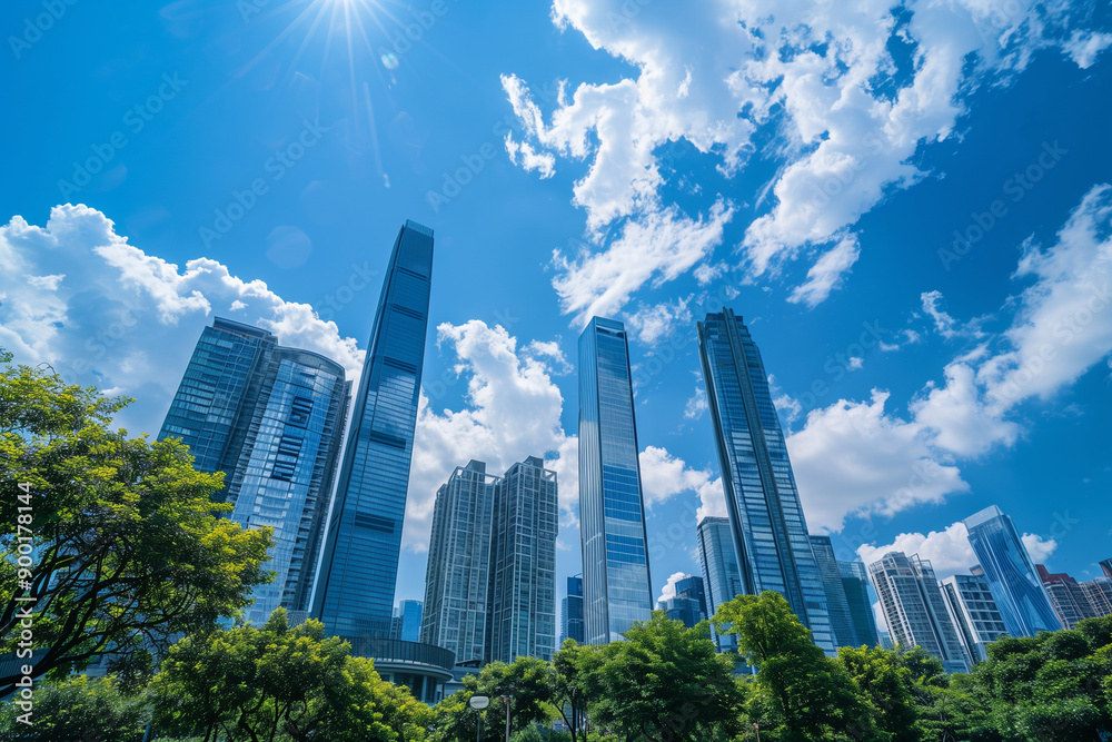 Skyscrapers Viewed from Below with Blue Sky and White Clouds