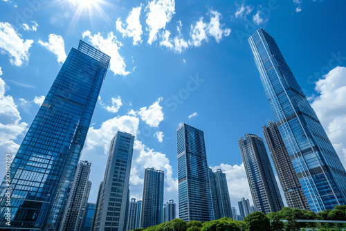 Skyscrapers Reaching into a Bright Blue Sky with White Clouds on a Sunny Day