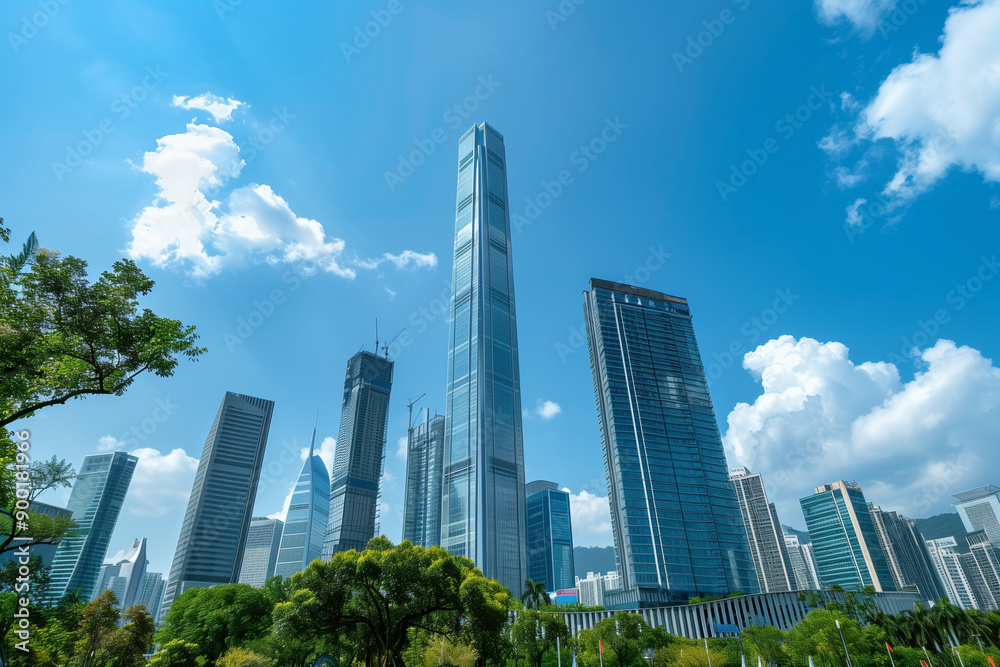 Skyscrapers Reaching into a Bright Blue Sky with White Clouds on a Sunny Day