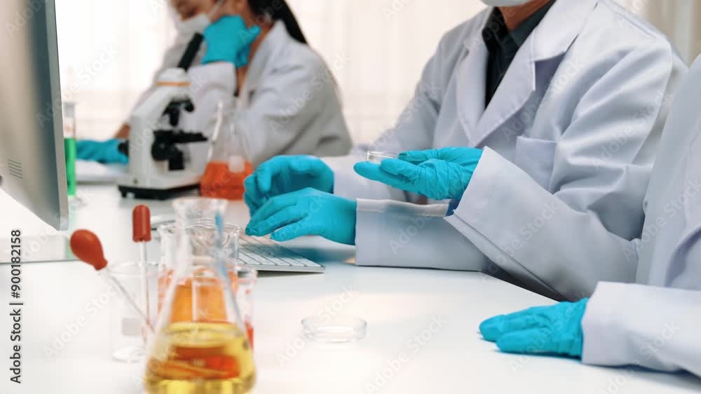 Laboratory healthcare researcher team with scientific expertise, lab equipment, and innovative medical biotechnology software in computer, research new medicines, develop cure. Slow motion. Rigid.