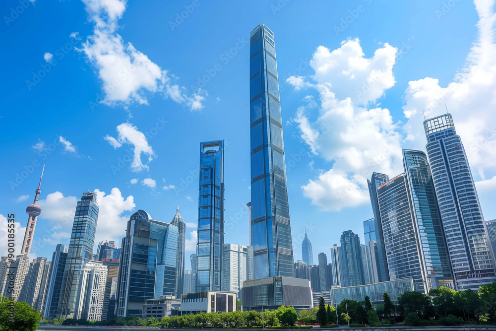 Skyscrapers Reaching into a Bright Blue Sky with White Clouds on a Sunny Day Skyscrapers Reaching into a Bright Blue Sky with White Clouds on a Sunny Day