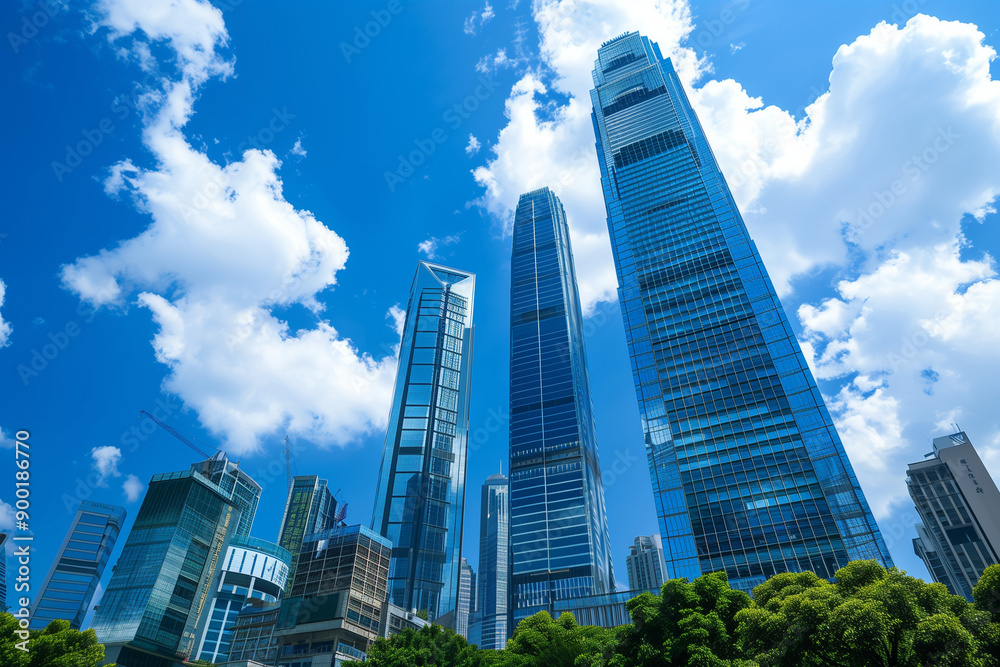 Skyscrapers Reaching into a Bright Blue Sky with White Clouds on a Sunny Day Skyscrapers Reaching into a Bright Blue Sky with White Clouds on a Sunny Day