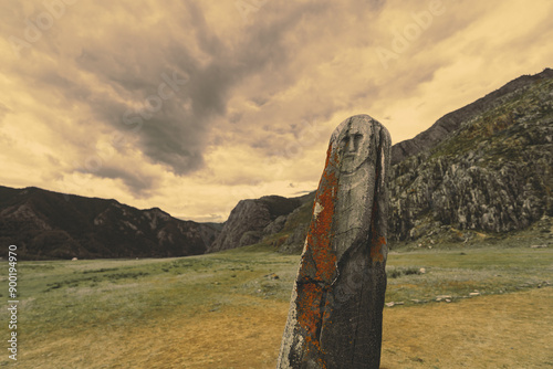 stone depicting a male face ancient Scythian period, The archaeological complex of Adyr-Kahn, Altai mountains, Russia photo