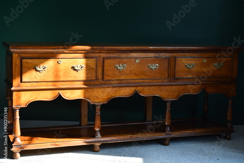 Antique oak sideboard on plain background photo