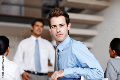 Boardroom, meeting and portrait of business man in office for coaching, seminar or workshop. Corporate, development and presentation with confident employee in workplace for upskill training © peopleimages.com