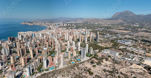 Obraz na płótnie Extremely wide aerial drone panoramic photo of the city Benidorm in Spain showing the whole of the city with high rise buildings and hotels and a clear view of the ocean front on a sunny summer day w salonie