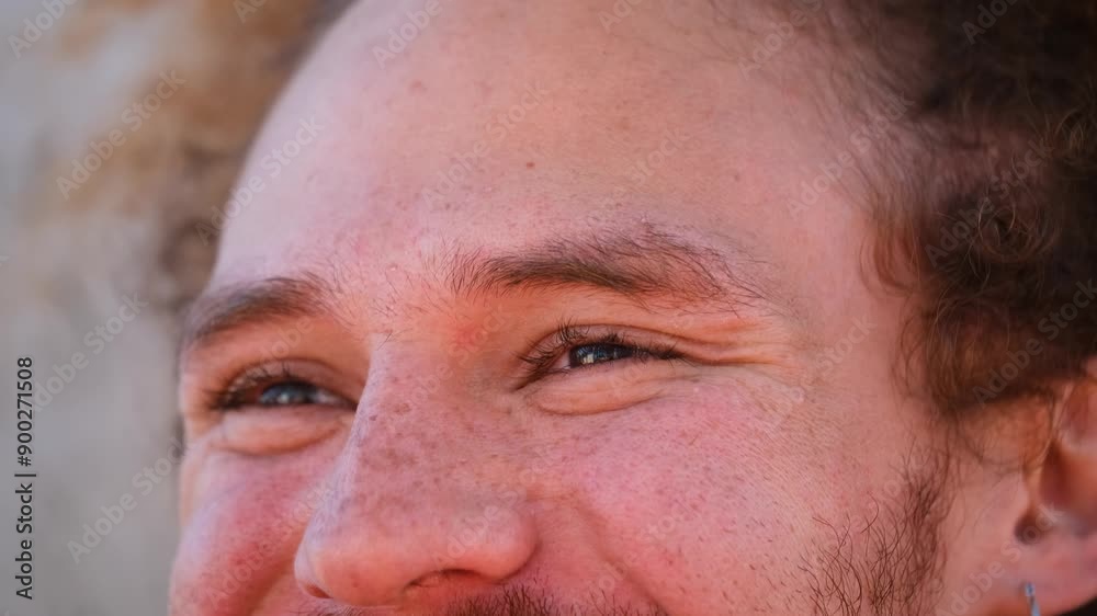 Close up of freckled skin man eyes smiling. Concept of happiness or content Close up of freckled skin man eyes smiling. Concept of happiness or content