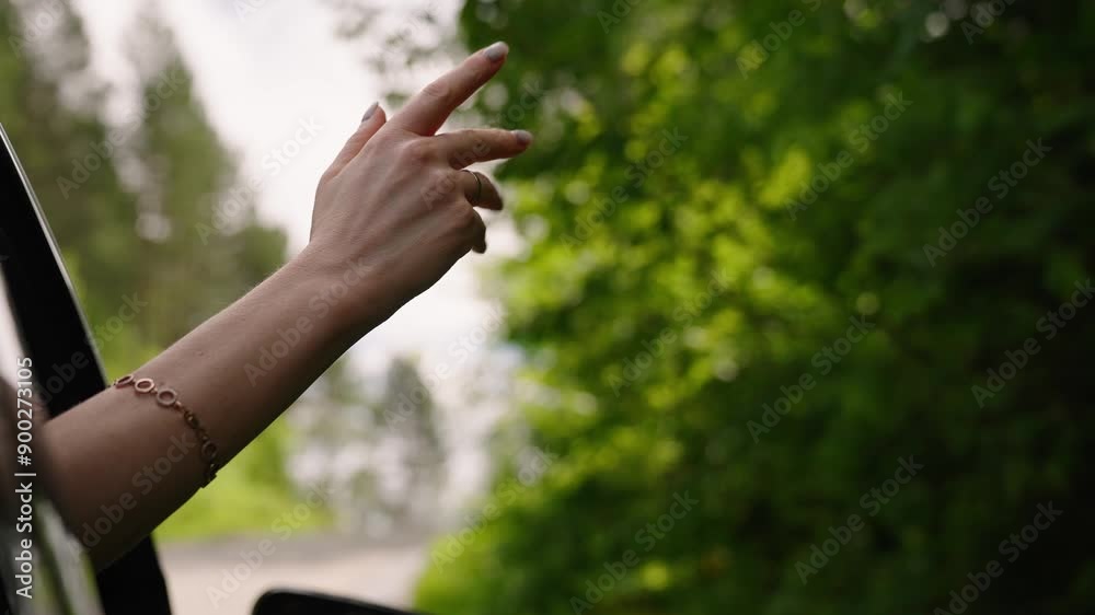 Hand plays with sun from car window against backdrop of beautiful sunset. Travel by car countryside. Hand plays with sun from car window against backdrop of beautiful sunset. Travel by car countryside.