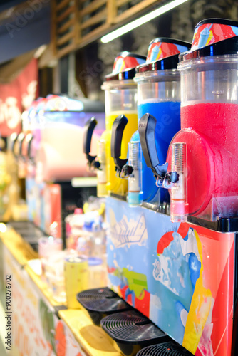 Colorful slush machine with blurred background