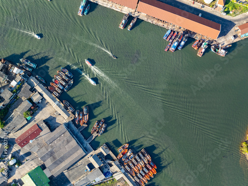 High angle view fisherman boats at the jetty located in Phuket Thailand, aerial view drone top down view,Siray fishing port Phuket Thailand photo