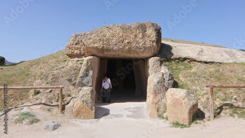 Caucasian mature woman visiting the dolmen of Antequera, Malaga, Spain.