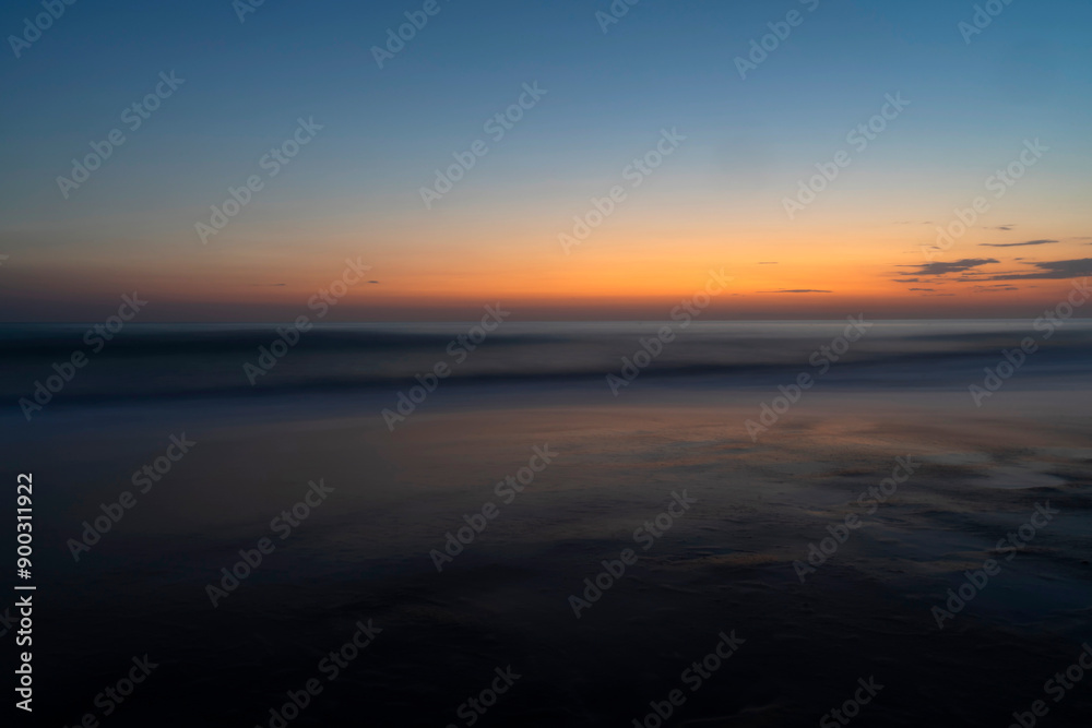 Blue hour at the Mediterranean Sea in Marina di Bibbona in Tuscany in Italy Blue hour at the Mediterranean Sea in Marina di Bibbona in Tuscany in Italy