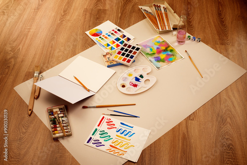 Drawing and art supplies on wooden background