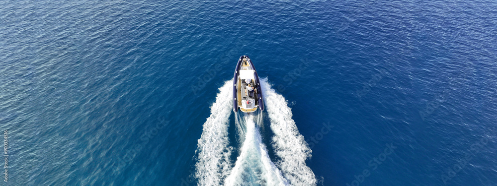 Aerial drone top down photo of luxury inflatable rib speed boat cruising in mediterranean sea