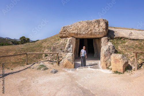 Slika na platnu Caucasian mature woman visiting the dolmen of Antequera, Malaga, Spain