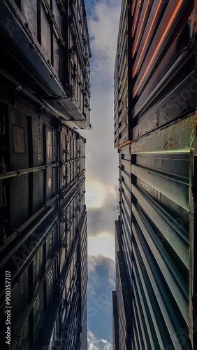 View of Containers from Below with Sky in Background