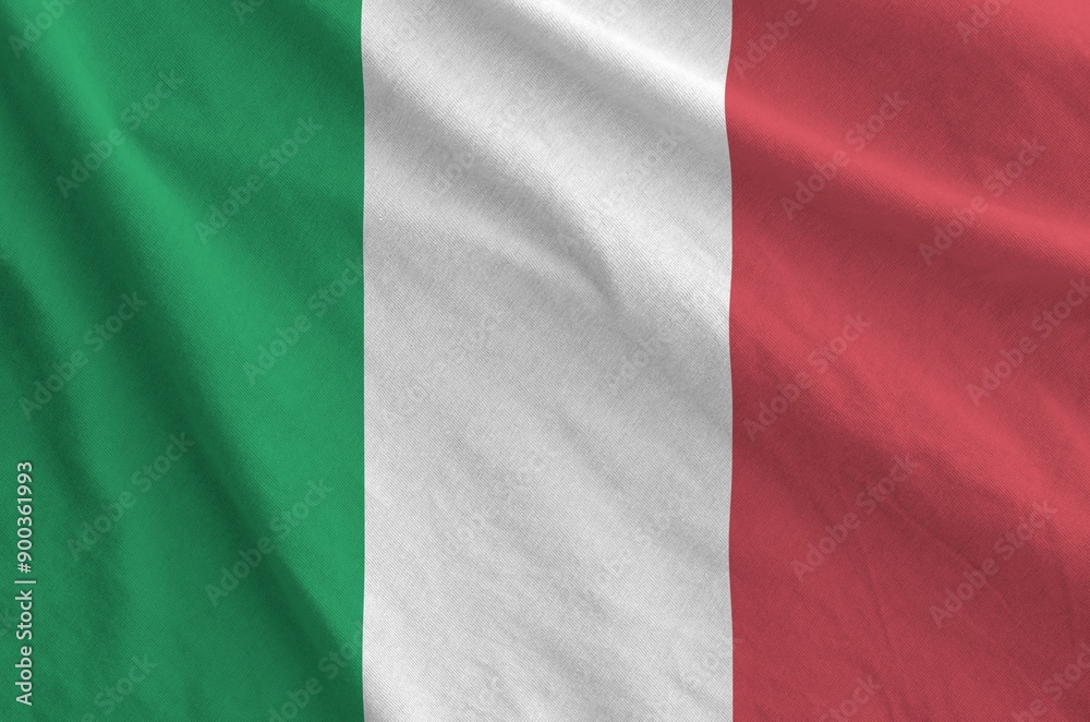 Italy flag depicted on folded wavy fabric of old cloth close up Italy flag depicted on folded wavy fabric of old cloth close up