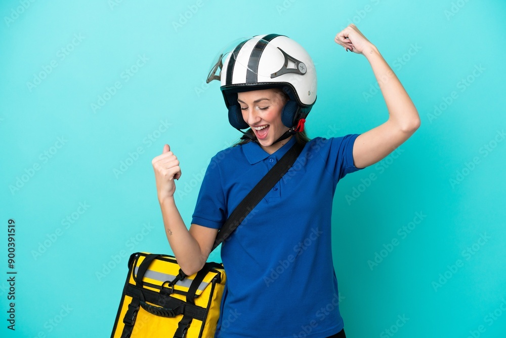 Young caucasian woman with thermal backpack isolated on white background celebrating a victory
