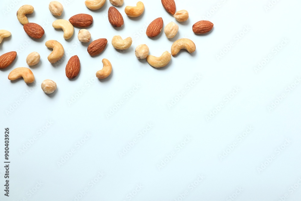 Mixed nuts on colored background Mixed nuts on colored background