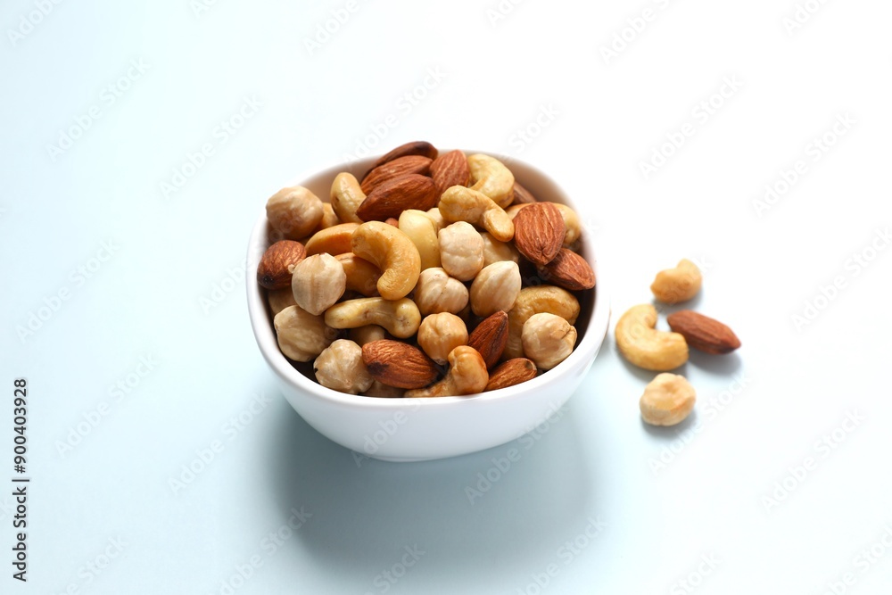 Mixed nuts on colored background Mixed nuts on colored background