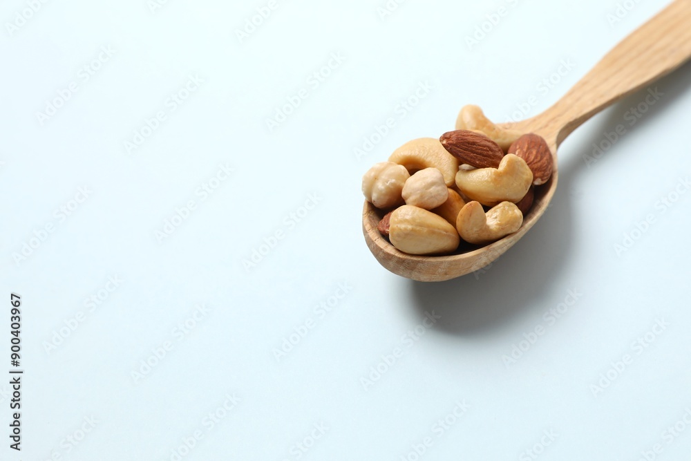 Mixed nuts on colored background Mixed nuts on colored background
