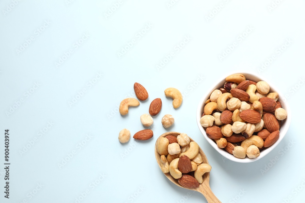 Mixed nuts on colored background Mixed nuts on colored background