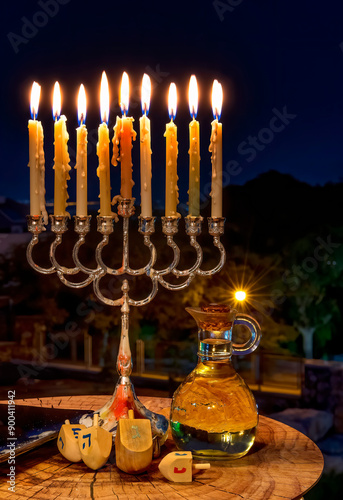 Glitter lights of candles and sweet festive donuts are traditional symbols fo...