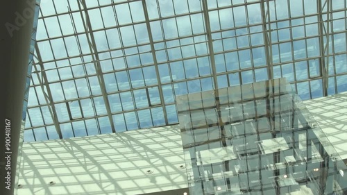 beautiful glass ceiling of big shopping mall with cloud sky through
