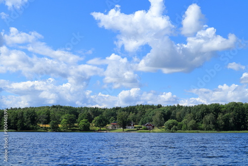 Fototapeta Naklejka Na Ścianę i Meble -  Swedish nature and summer day at a lake called Lejondalssjön. Upplands-Bro, Stockholm, Sweden. Landscape view.